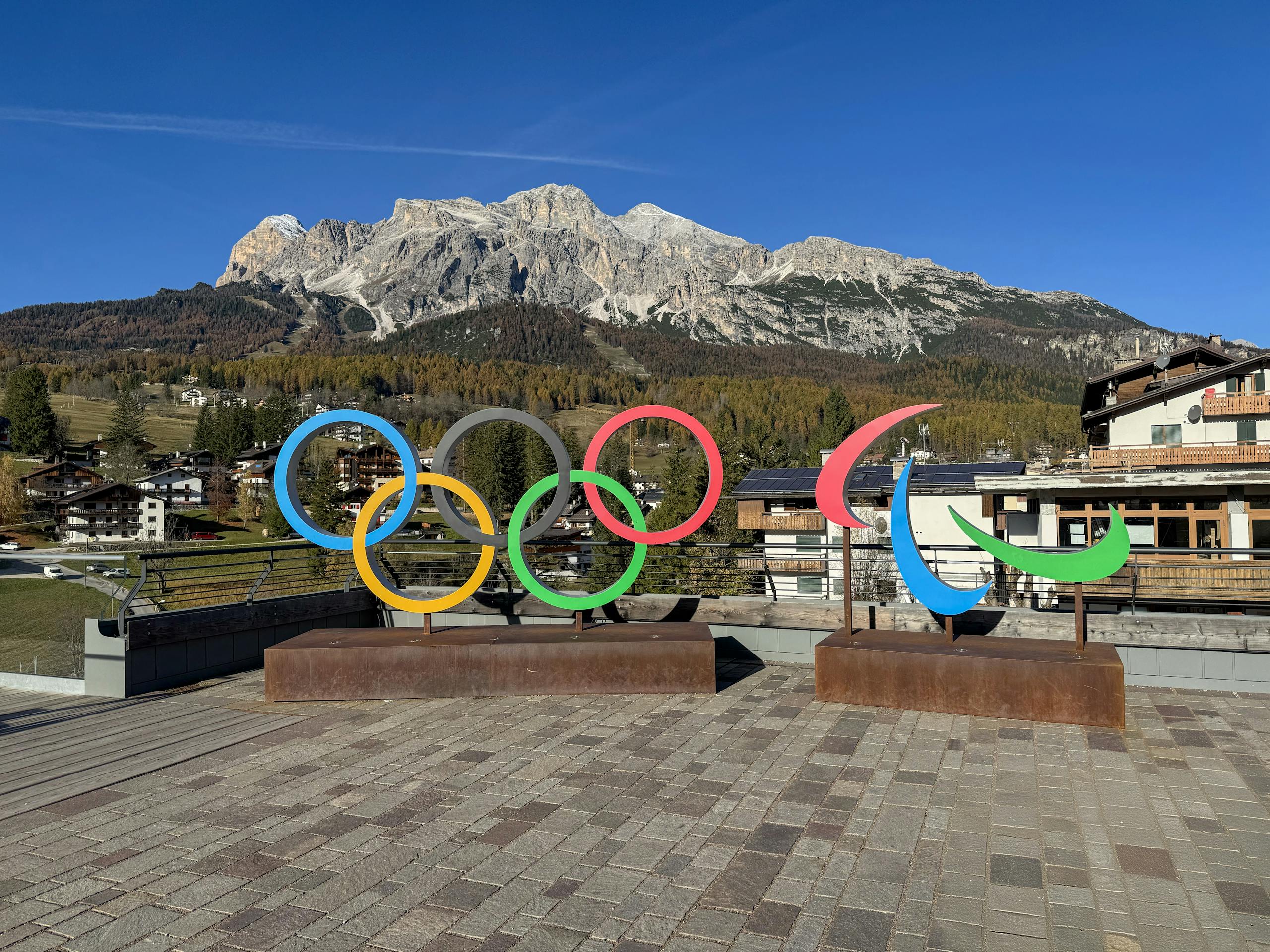 Stunning view of Olympic and inclusive Paralympic symbols set against the Italian Alps in Cortina d'Ampezzo.